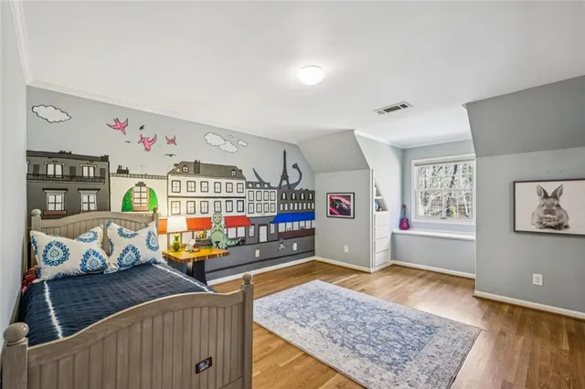 a living room with lots of furniture and wooden floor