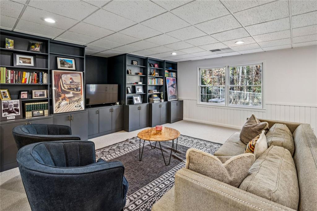 4575 Jett Road Atlanta, GA 30327 - Photo 29 of 42 a living room with furniture and a book shelf