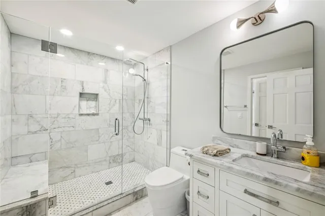 a living room with furniture washer and a flat screen tv