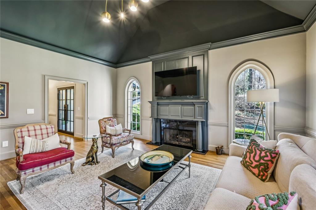 4575 Jett Road Atlanta, GA 30327 - Photo 5 of 42 a living room with furniture and a fireplace