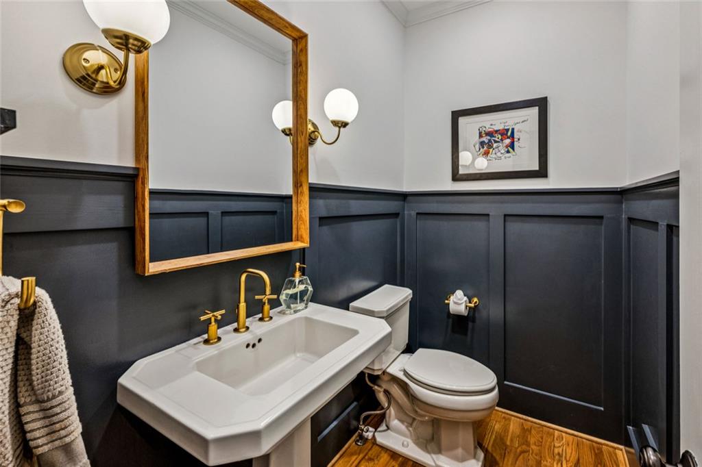 4575 Jett Road Atlanta, GA 30327 - Photo 6 of 42 a bathroom with a sink a toilet and a mirror