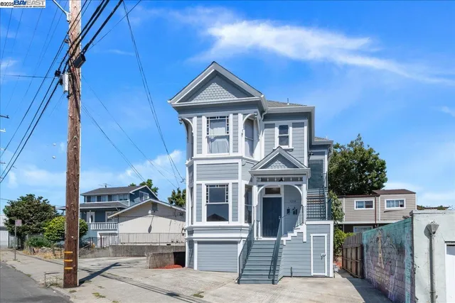 a view of residential houses with street