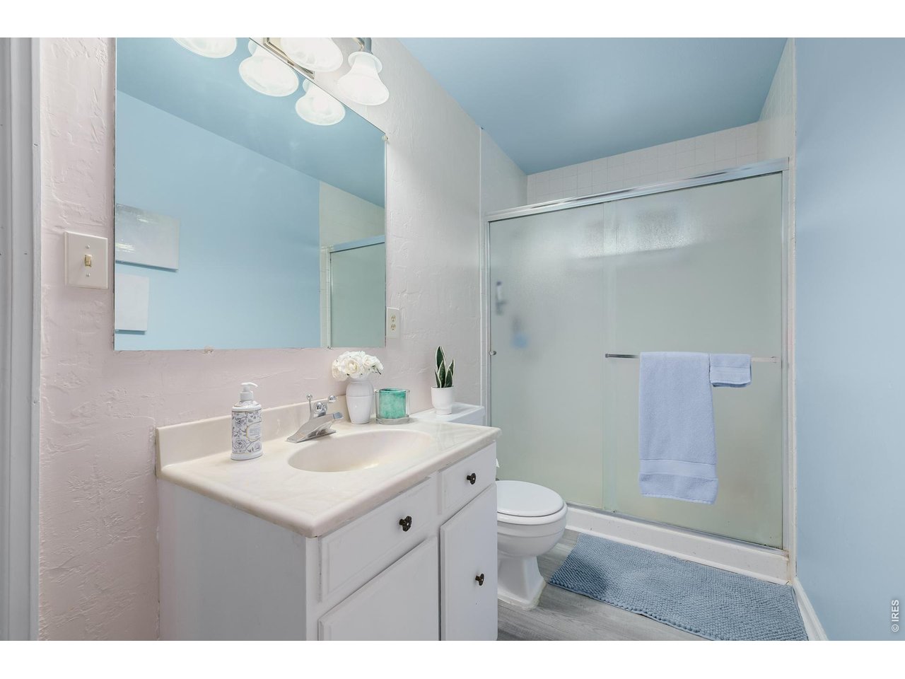 37 High View Lane Boulder, CO 80302 - Photo 27 of 50 a bathroom with a sink mirror toilet and vanity