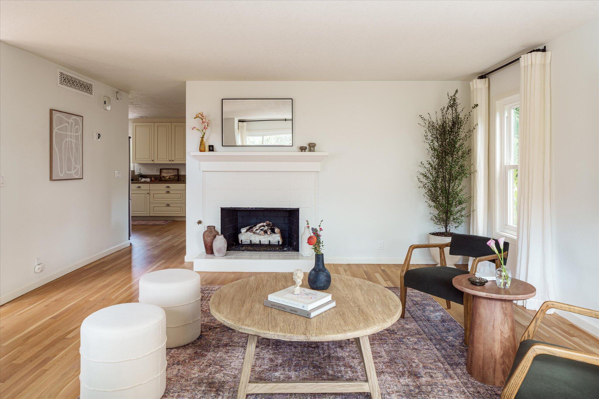 422 Alan Road Santa Barbara, CA 93109 - Photo 12 of 38 a living room with furniture and a fireplace