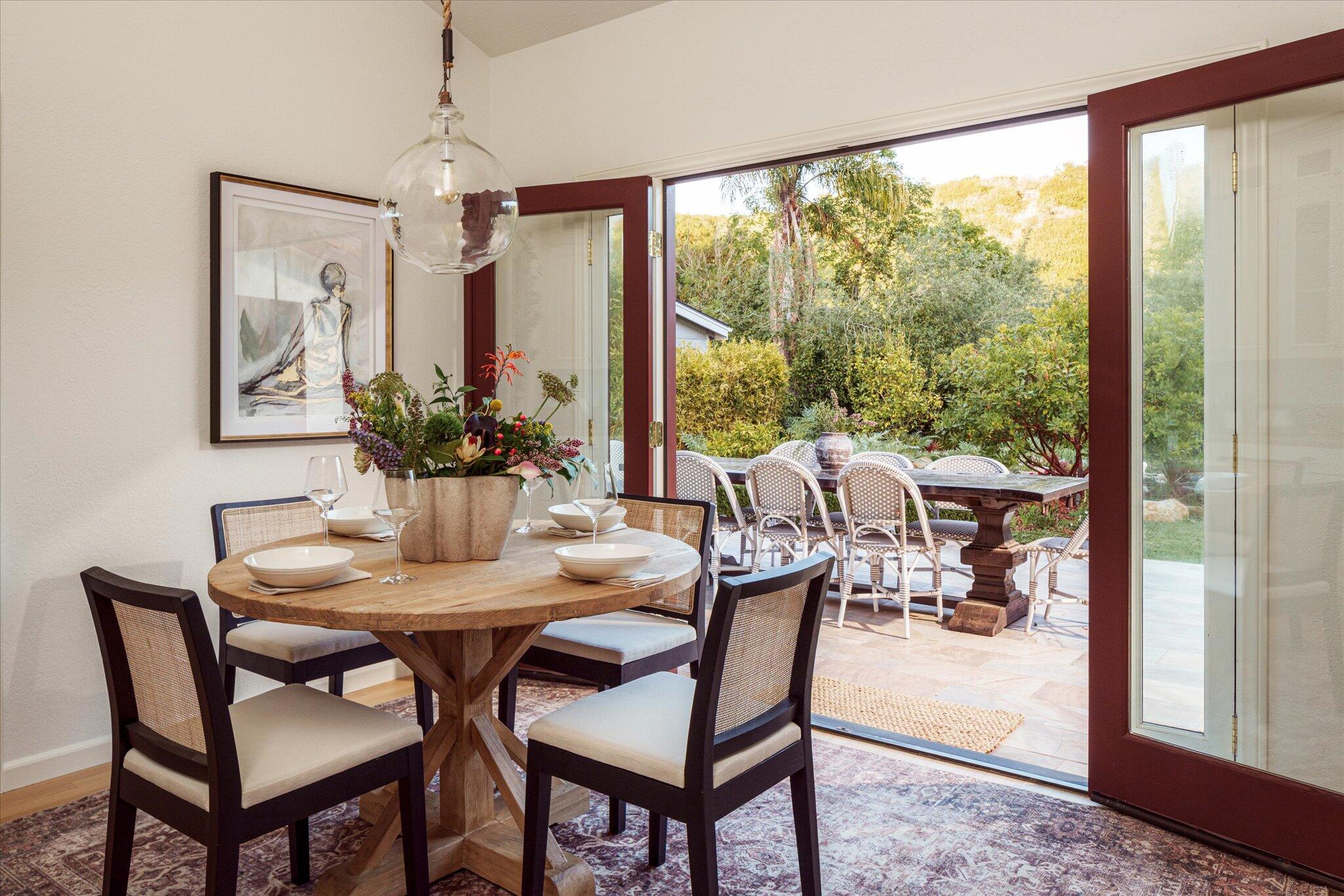 422 Alan Road Santa Barbara, CA 93109 - Photo 17 of 38 a view of a dining room with furniture window and outside view