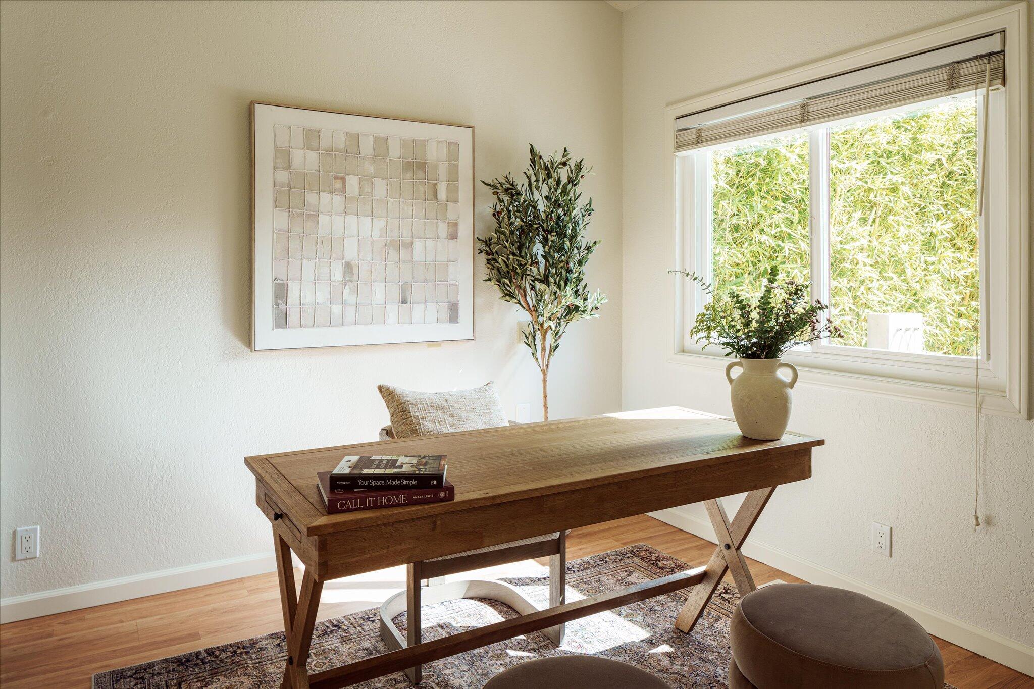 422 Alan Road Santa Barbara, CA 93109 - Photo 18 of 38 a table with a vase and a window