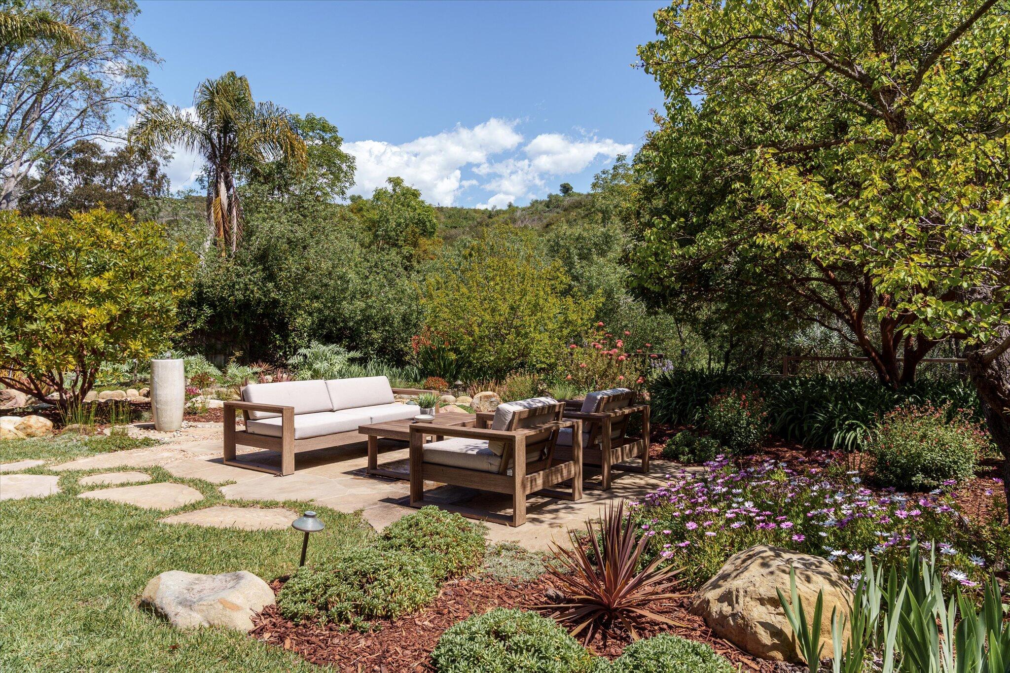 422 Alan Road Santa Barbara, CA 93109 - Photo 23 of 38 a backyard of a house with outdoor seating