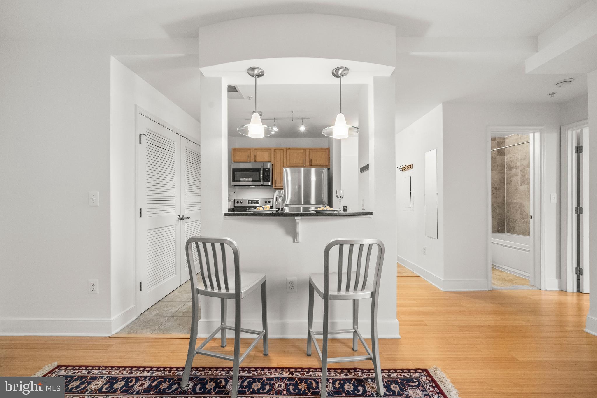 1106 Columbia Road Northwest, Unit 304 Washington, DC 20009 - Photo 8 of 24 a dining room with furniture and window