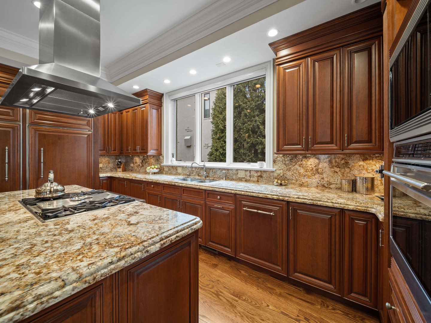 700 Greenwood Road Northbrook, IL 60062 - Photo 22 of 81 a kitchen with granite countertop sink stove and cabinets