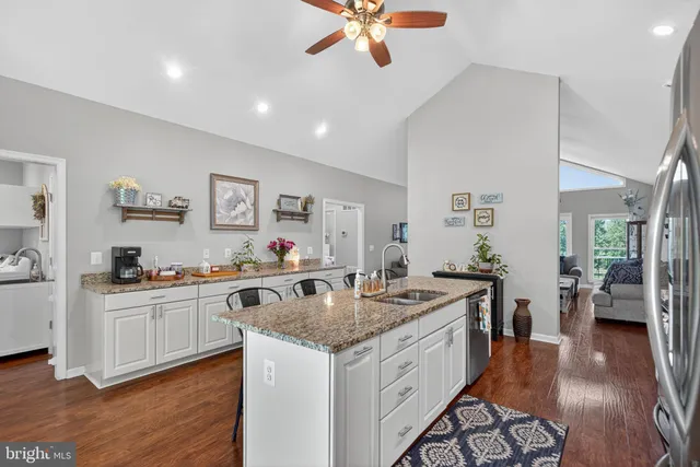 a bedroom with a bed and large windows