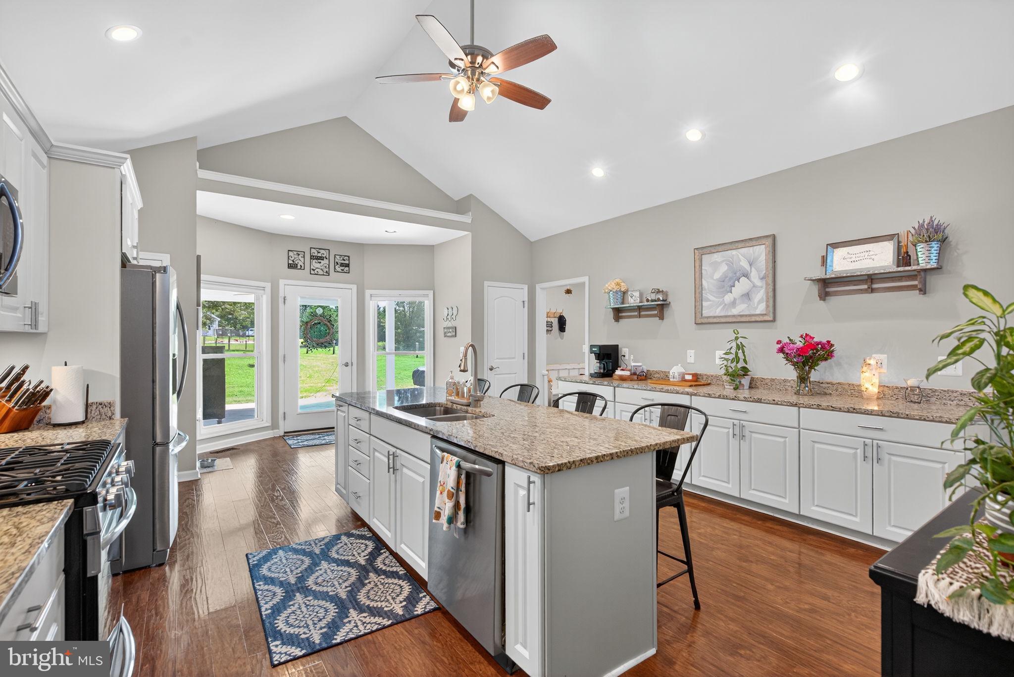 14451 Jenkins Ridge Road Culpeper, VA 22701 - Photo 12 of 78 a kitchen with sink stove and cabinets