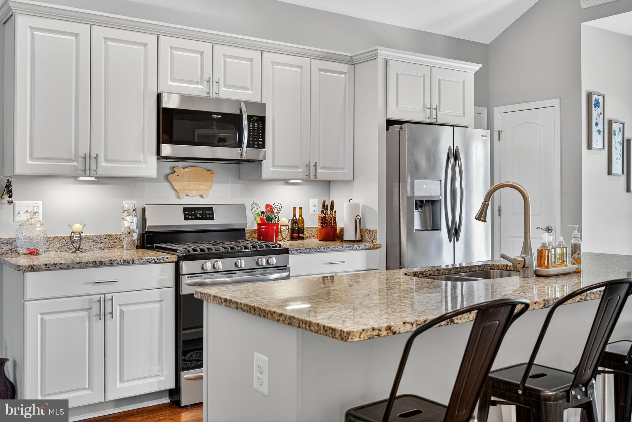 14451 Jenkins Ridge Road Culpeper, VA 22701 - Photo 15 of 78 a kitchen with stainless steel appliances granite countertop a stove a sink dishwasher and a refrigerator