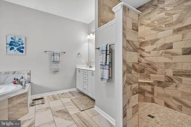 a view of a lush green forest with a lake