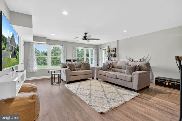 an aerial view of a house with swimming pool garden and outdoor seating