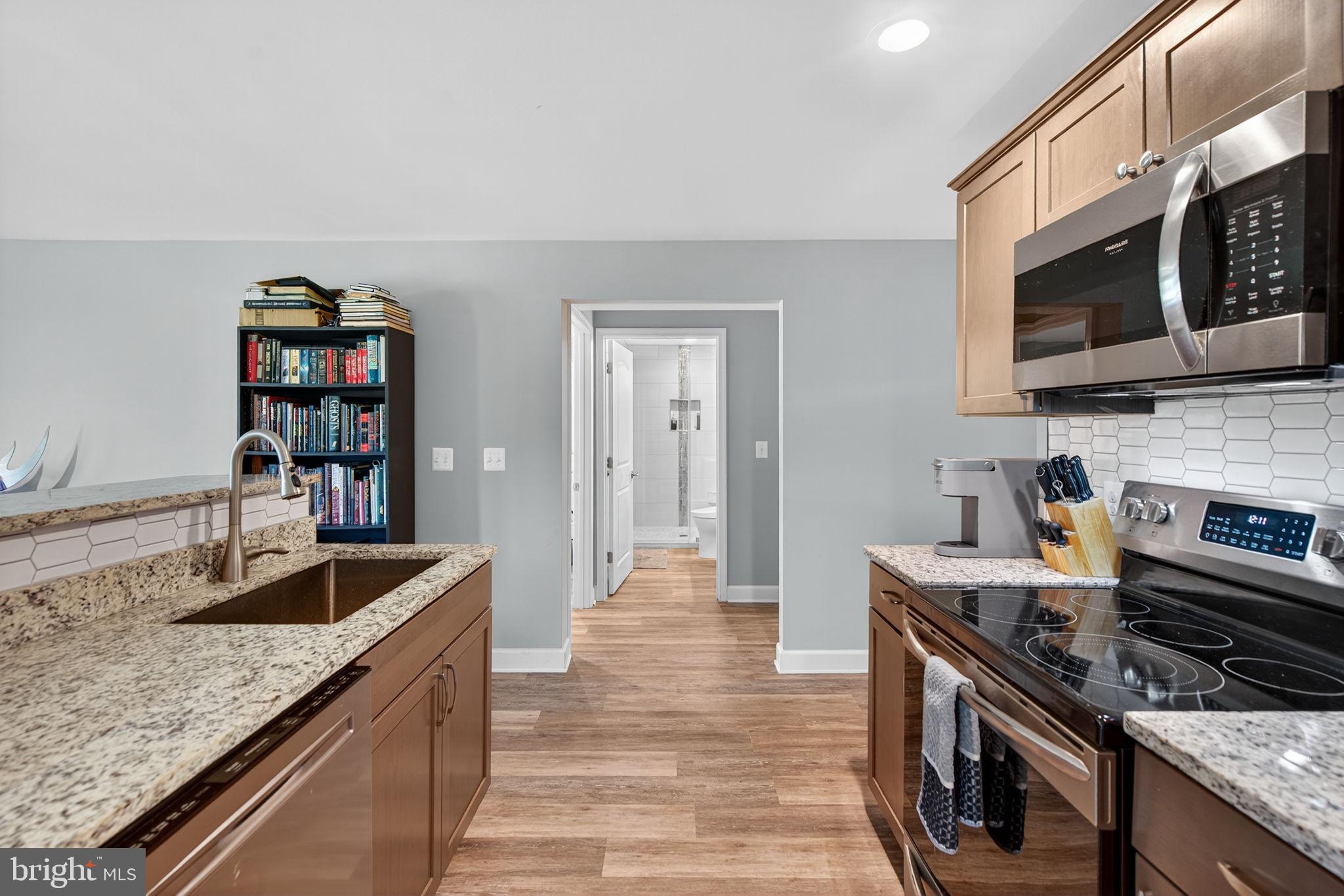 14451 Jenkins Ridge Road Culpeper, VA 22701 - Photo 41 of 78 a kitchen with stainless steel appliances granite countertop a sink dishwasher stove and oven