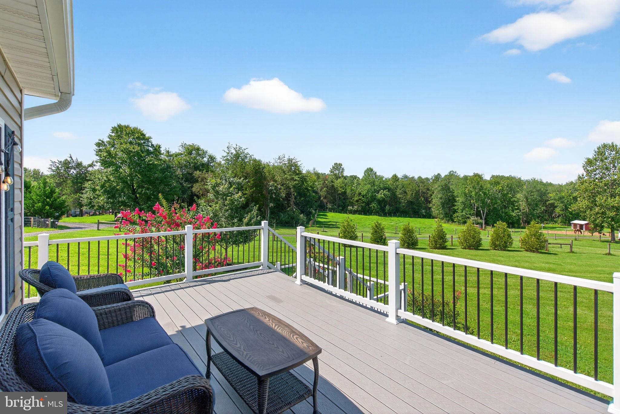 14451 Jenkins Ridge Road Culpeper, VA 22701 - Photo 55 of 78 a view of a chair and tables in the balcony