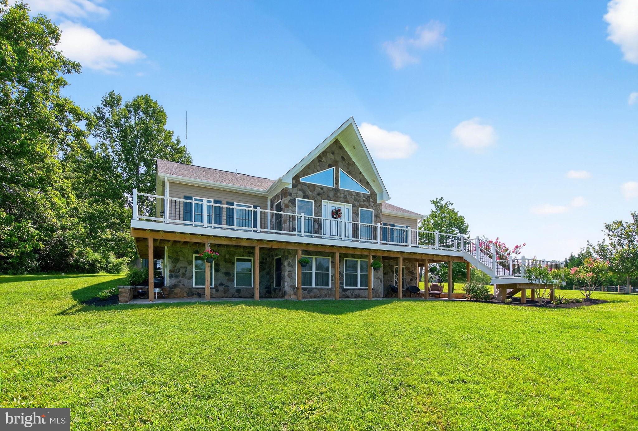 14451 Jenkins Ridge Road Culpeper, VA 22701 - Photo 58 of 78 a view of an house with backyard and outdoor seating