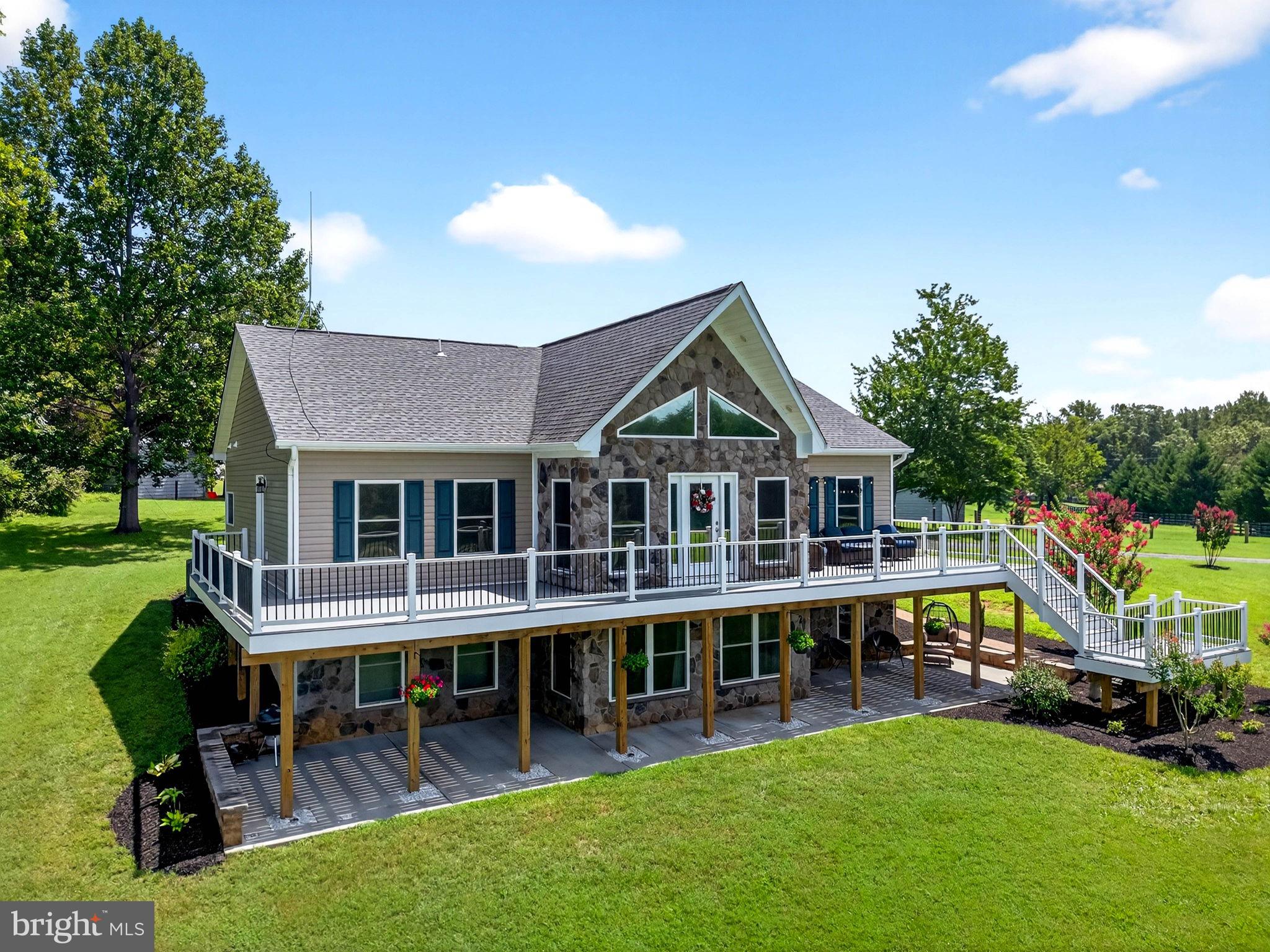 14451 Jenkins Ridge Road Culpeper, VA 22701 - Photo 69 of 78 a view of a house with a yard deck and sitting area