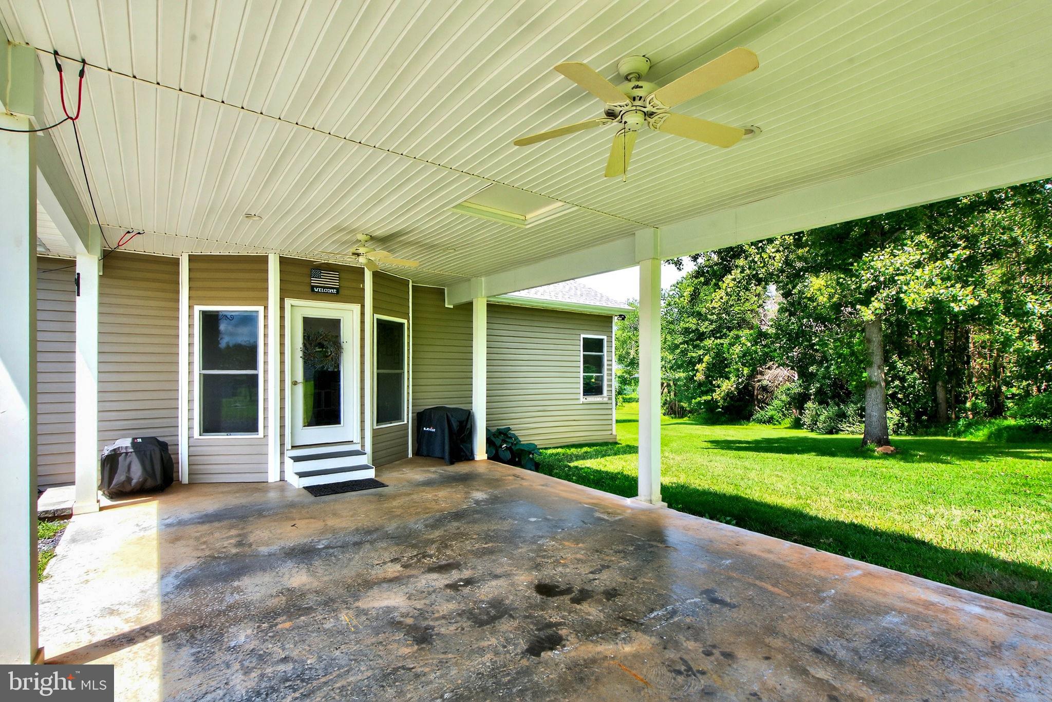 14451 Jenkins Ridge Road Culpeper, VA 22701 - Photo 71 of 78 a view of a house with backyard and porch