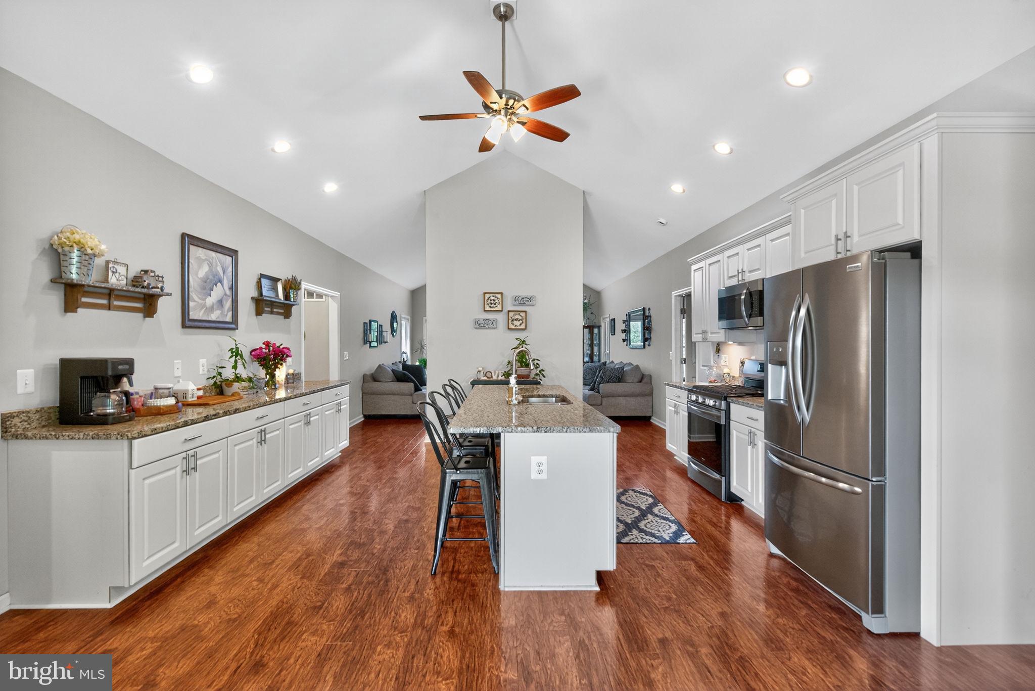 14451 Jenkins Ridge Road Culpeper, VA 22701 - Photo 10 of 78 a large kitchen with kitchen island a large counter top space a sink stainless steel appliances and cabinets