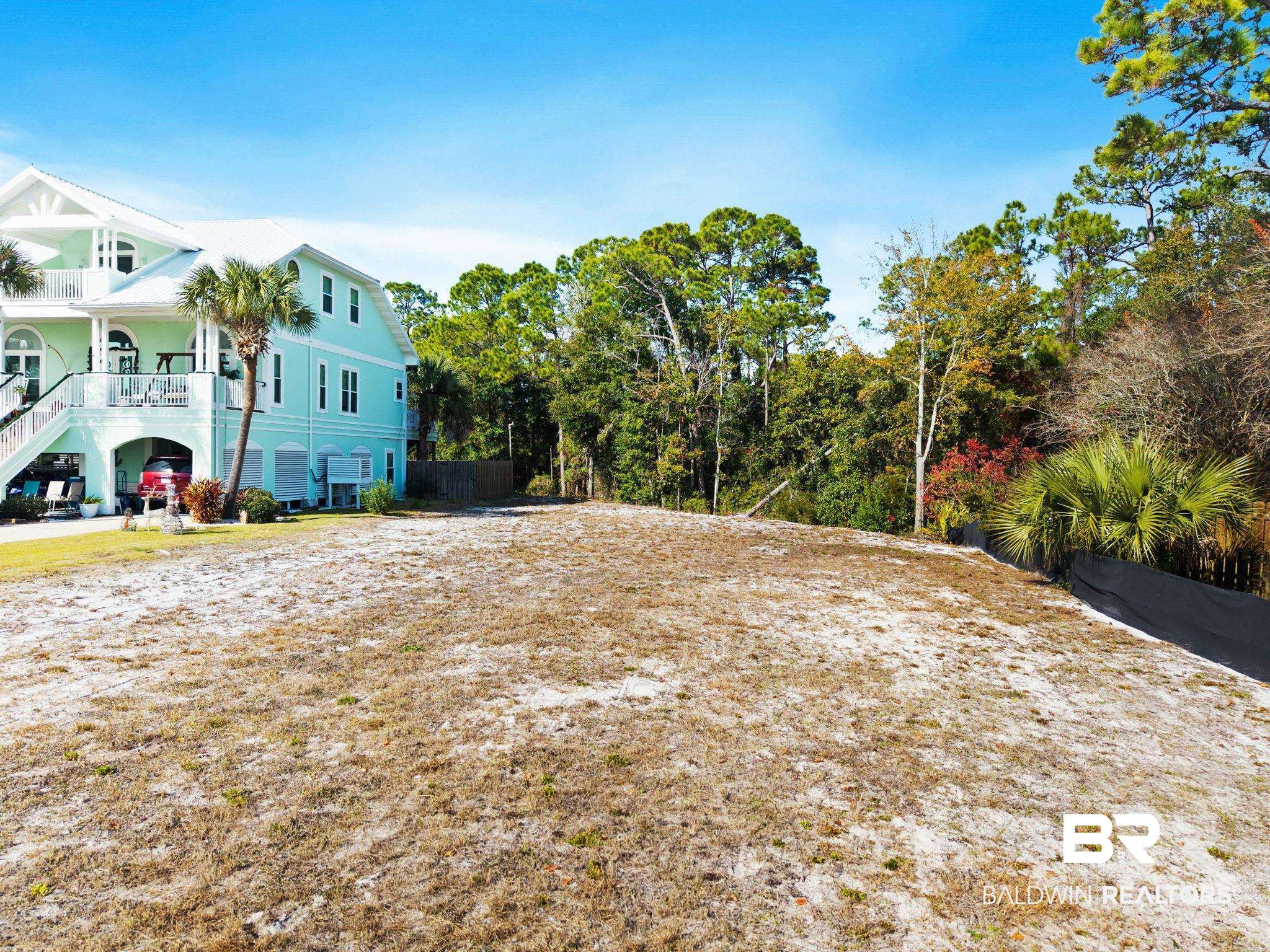 4143 Harbor Road Orange Beach, AL 36561 - Photo 9 of 33 View of property exterior featuring covered porch
