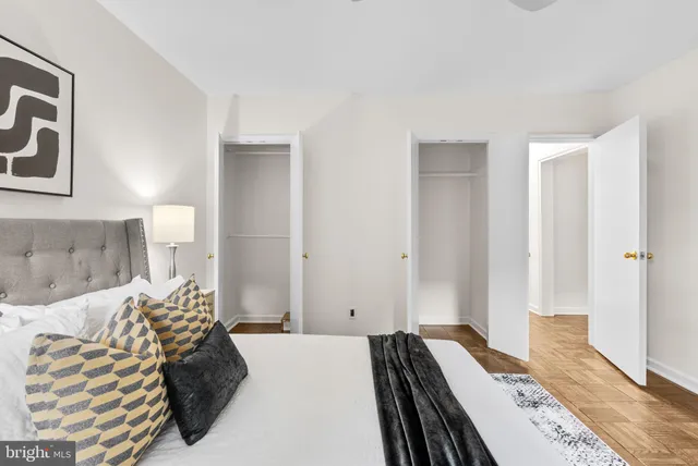 a bedroom with a bed and a couch