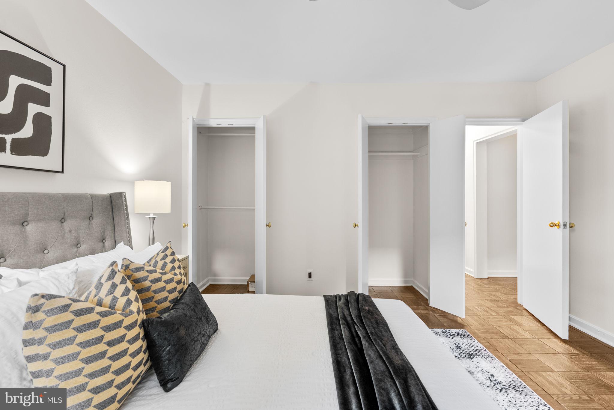 4820 Chevy Chase Drive, Unit 101 Chevy Chase, MD 20815 - Photo 17 of 30 a bedroom with a bed and a couch