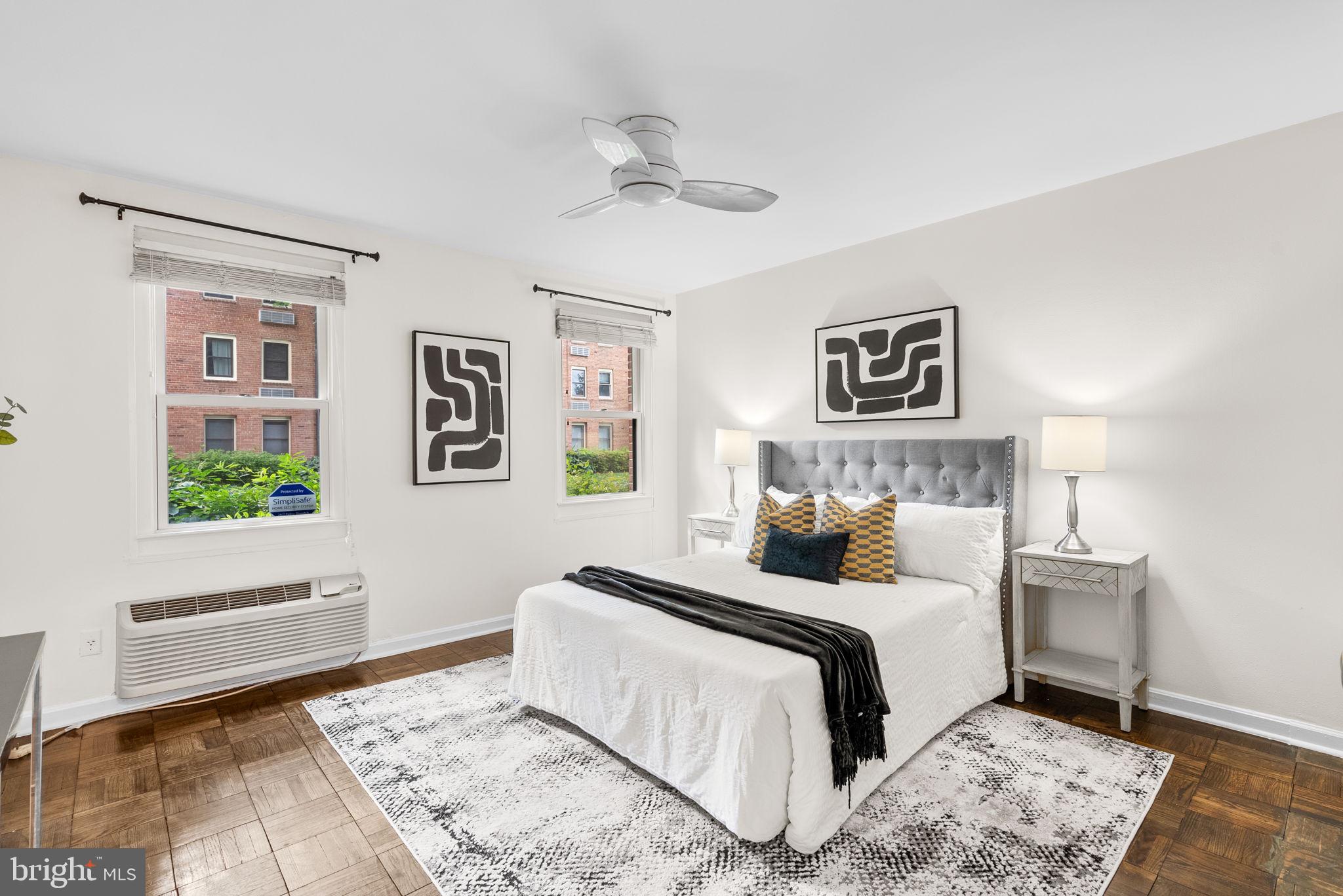 4820 Chevy Chase Drive, Unit 101 Chevy Chase, MD 20815 - Photo 19 of 30 a bedroom with a large bed and a window