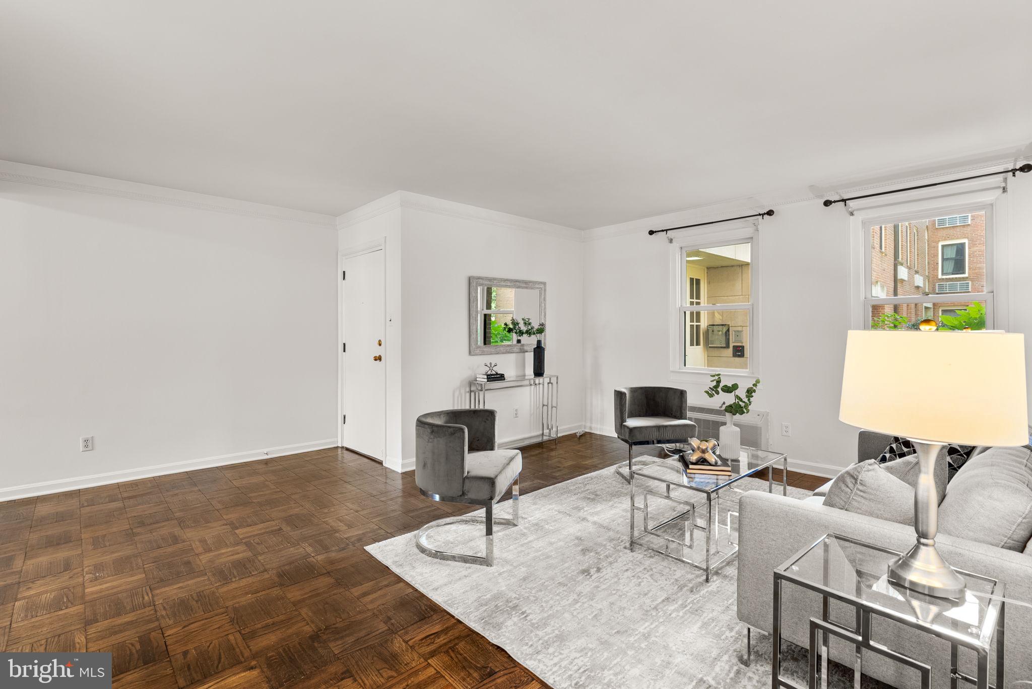 4820 Chevy Chase Drive, Unit 101 Chevy Chase, MD 20815 - Photo 2 of 30 a living room with furniture