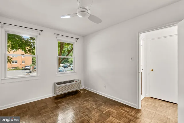a view of room with window and ceiling fan