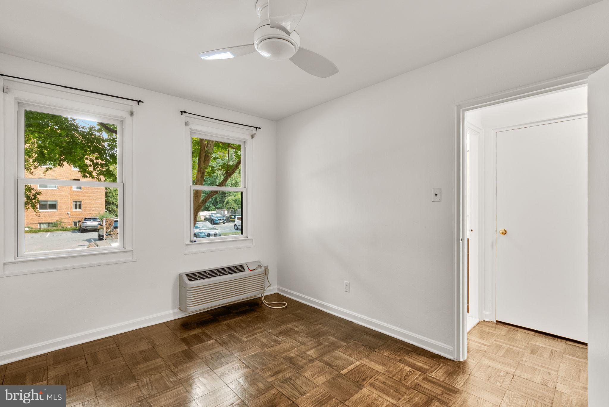 4820 Chevy Chase Drive, Unit 101 Chevy Chase, MD 20815 - Photo 22 of 30 a view of room with window and ceiling fan
