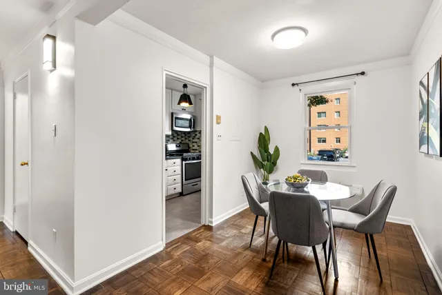 a dining room with furniture and window