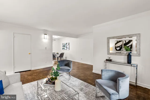 a living room with furniture and a rug