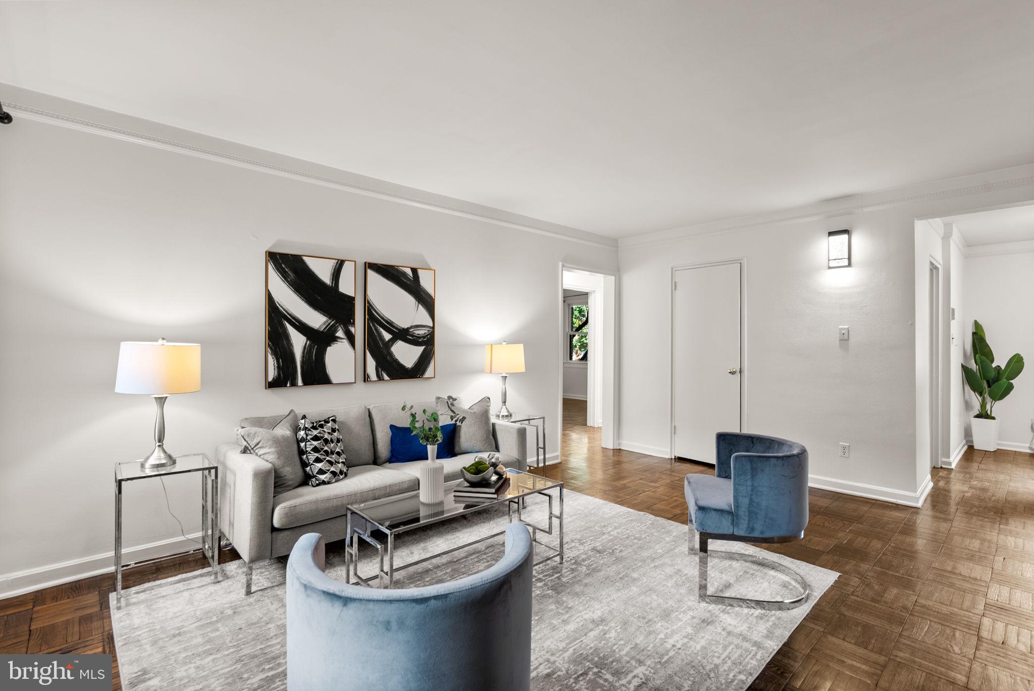 4820 Chevy Chase Drive, Unit 101 Chevy Chase, MD 20815 - Photo 8 of 30 a living room with furniture and a wooden floor