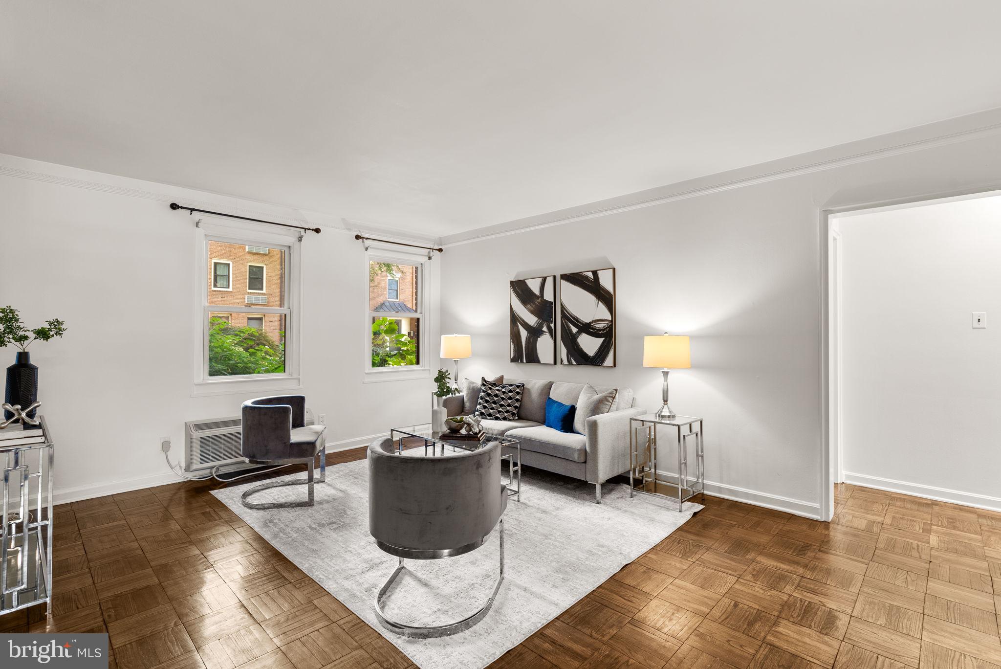 4820 Chevy Chase Drive, Unit 101 Chevy Chase, MD 20815 - Photo 9 of 30 a living room with furniture and a window