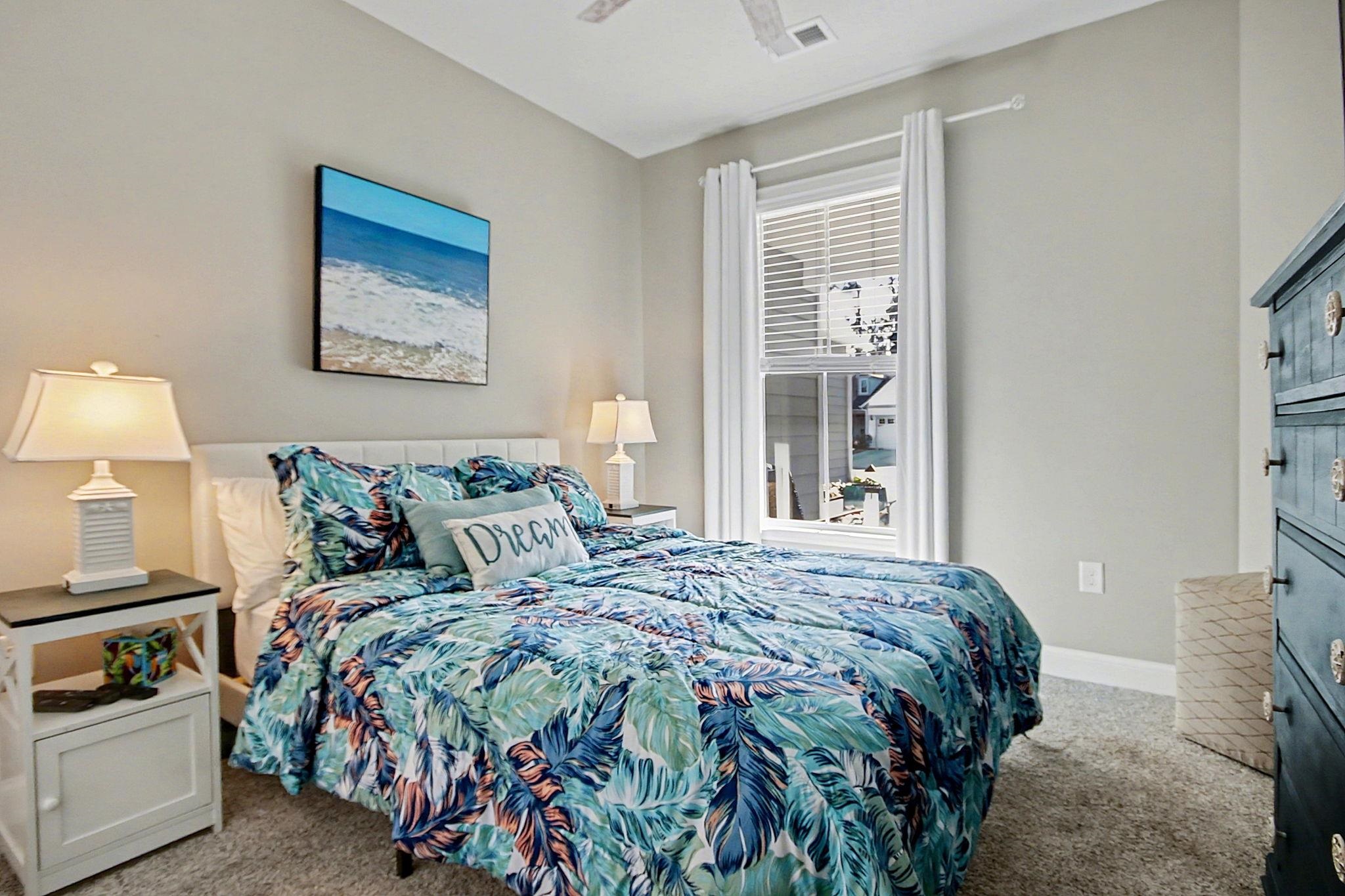 5830 Cremona Drive Myrtle Beach, SC 29577 - Photo 8 of 39 Bedroom with light carpet and a ceiling fan