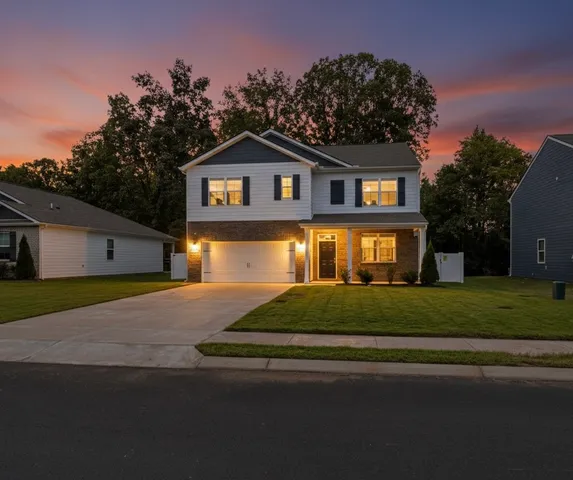 a front view of a house with a yard