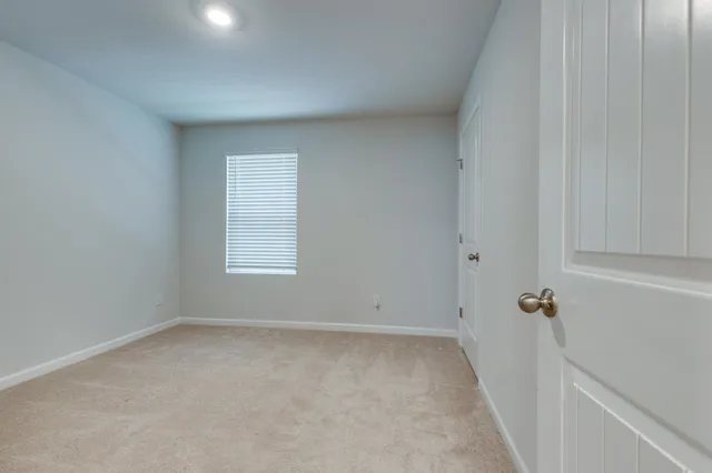 a view of room with hardwood floor