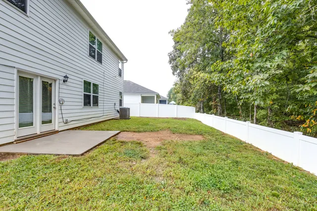 a view of backyard with swimming pool