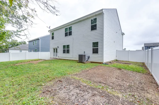 a view of a backyard of the house