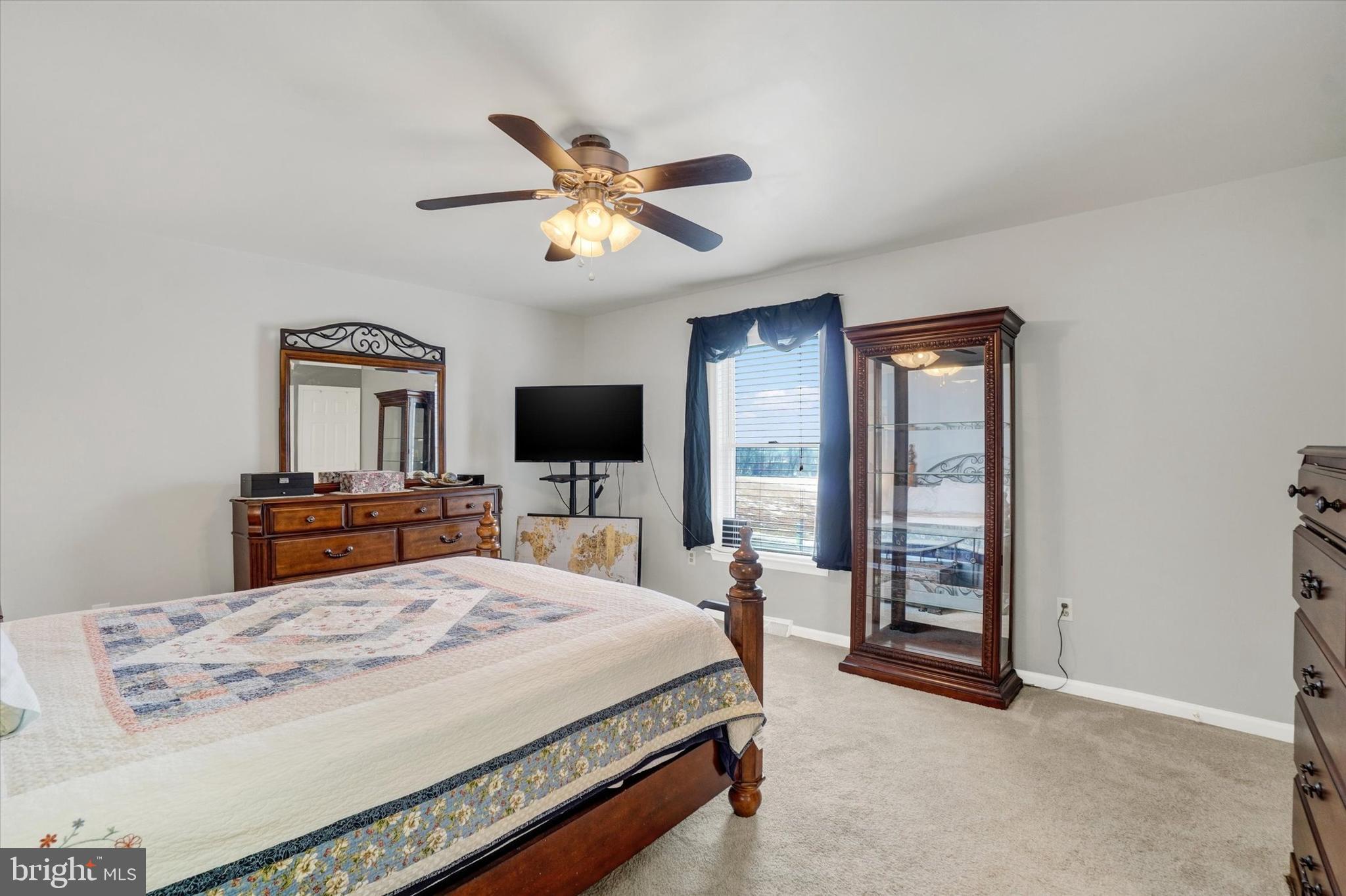 194 Willis Road Etters, PA 17319 - Photo 17 of 31 a bedroom with a bed and a flat screen tv