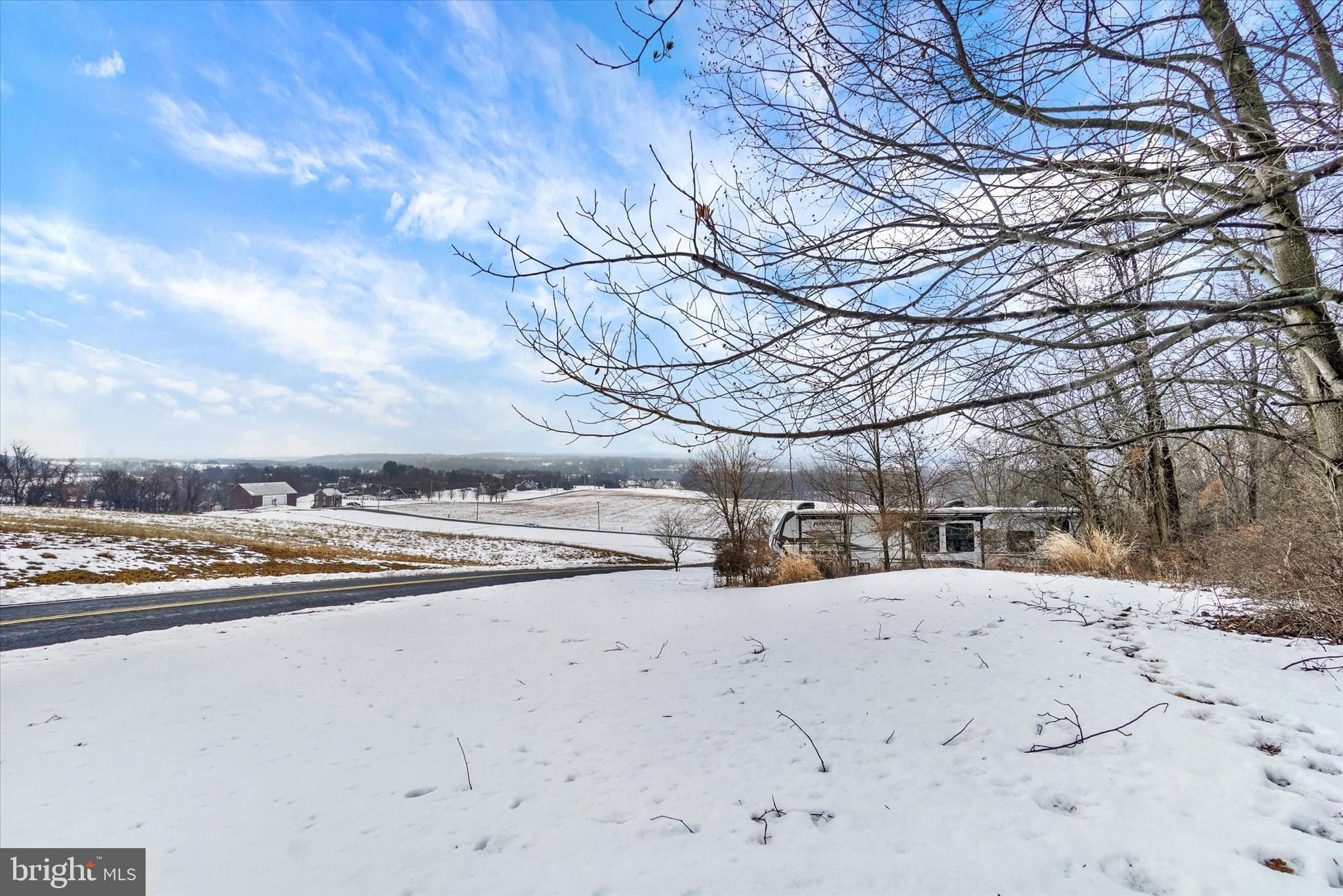 194 Willis Road Etters, PA 17319 - Photo 19 of 31 a view of a yard with snow on the road
