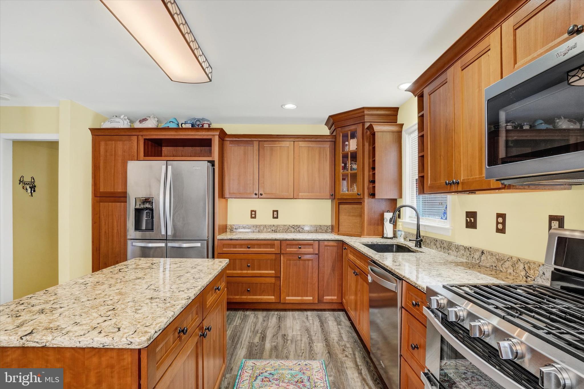 194 Willis Road Etters, PA 17319 - Photo 8 of 31 a kitchen with stainless steel appliances granite countertop a sink stove and refrigerator