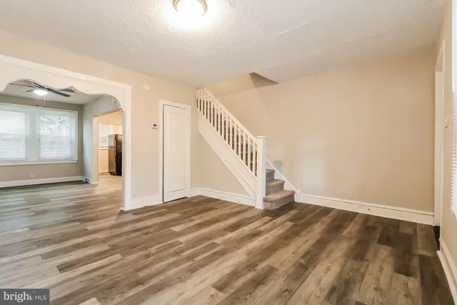 a view of an entryway with wooden floor