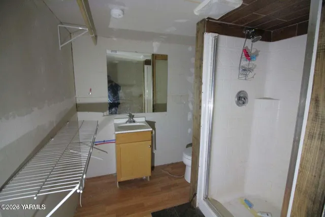 a bathroom with a tub and shower