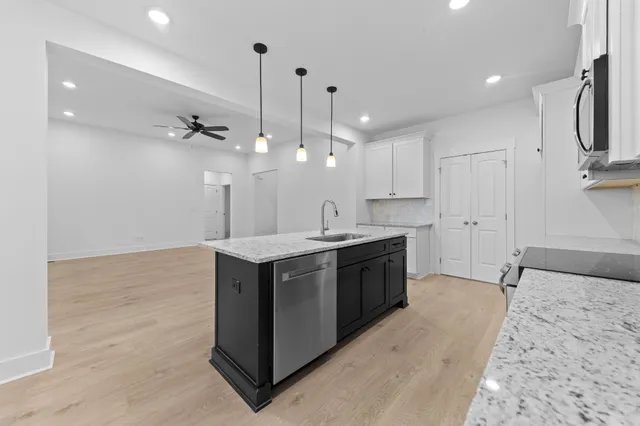 a bathroom with a granite countertop sink mirror and