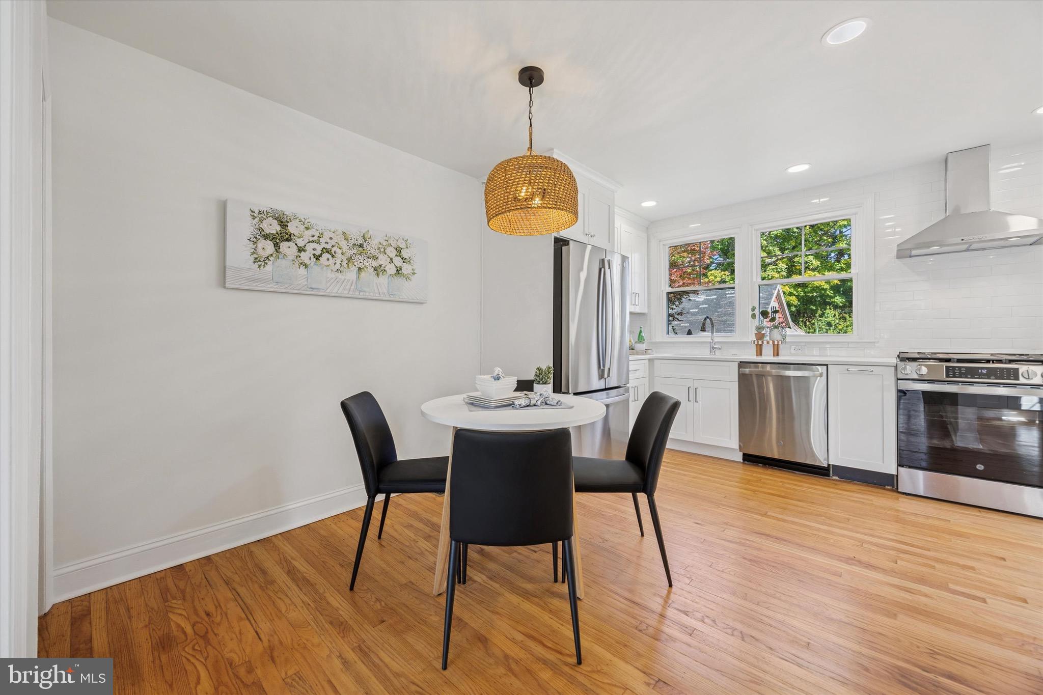 5 Llanfair Road Ardmore, PA 19003 - Photo 15 of 25 a view of a dining room with furniture window and wooden floor