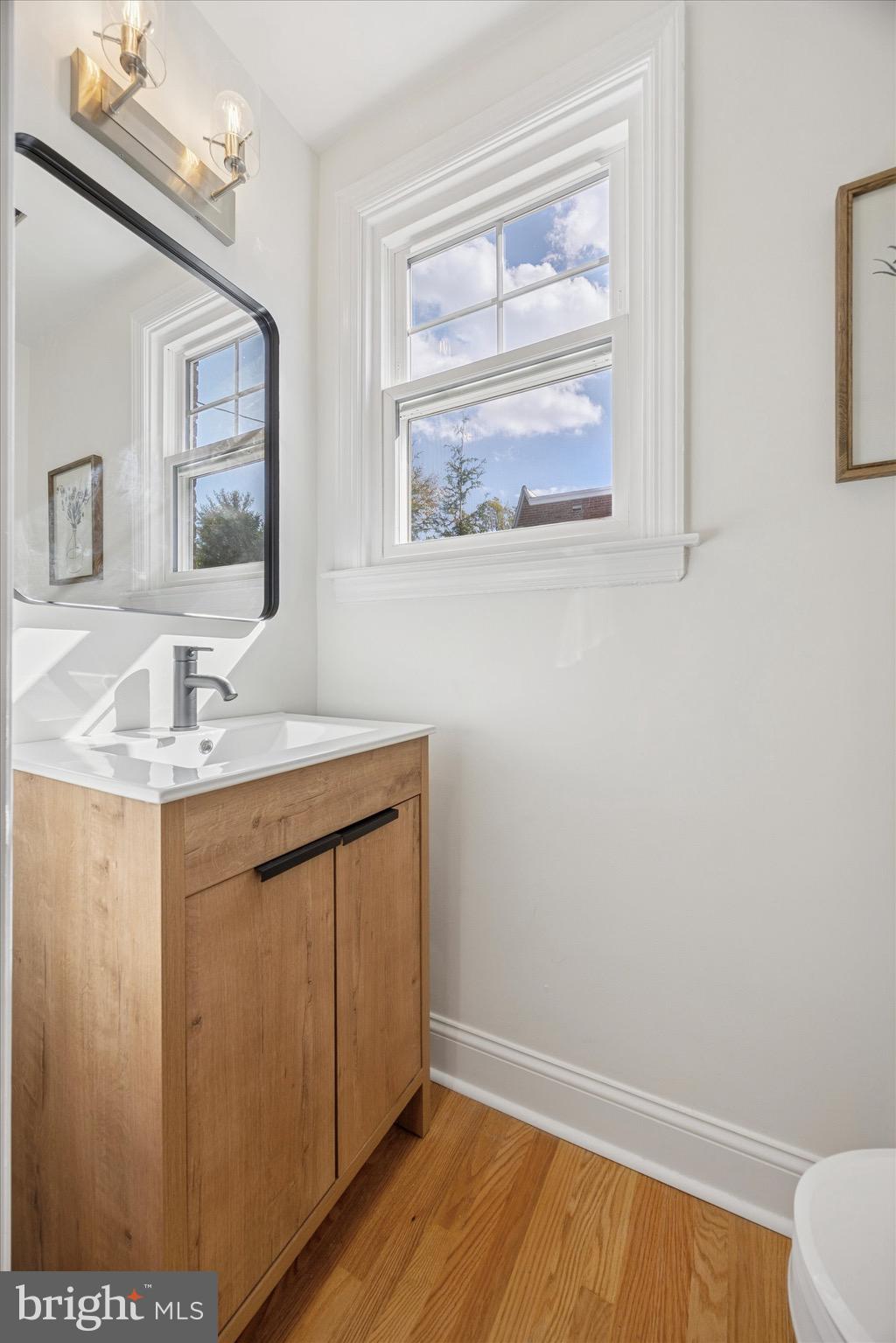 5 Llanfair Road Ardmore, PA 19003 - Photo 17 of 25 a bathroom with a sink and a mirror