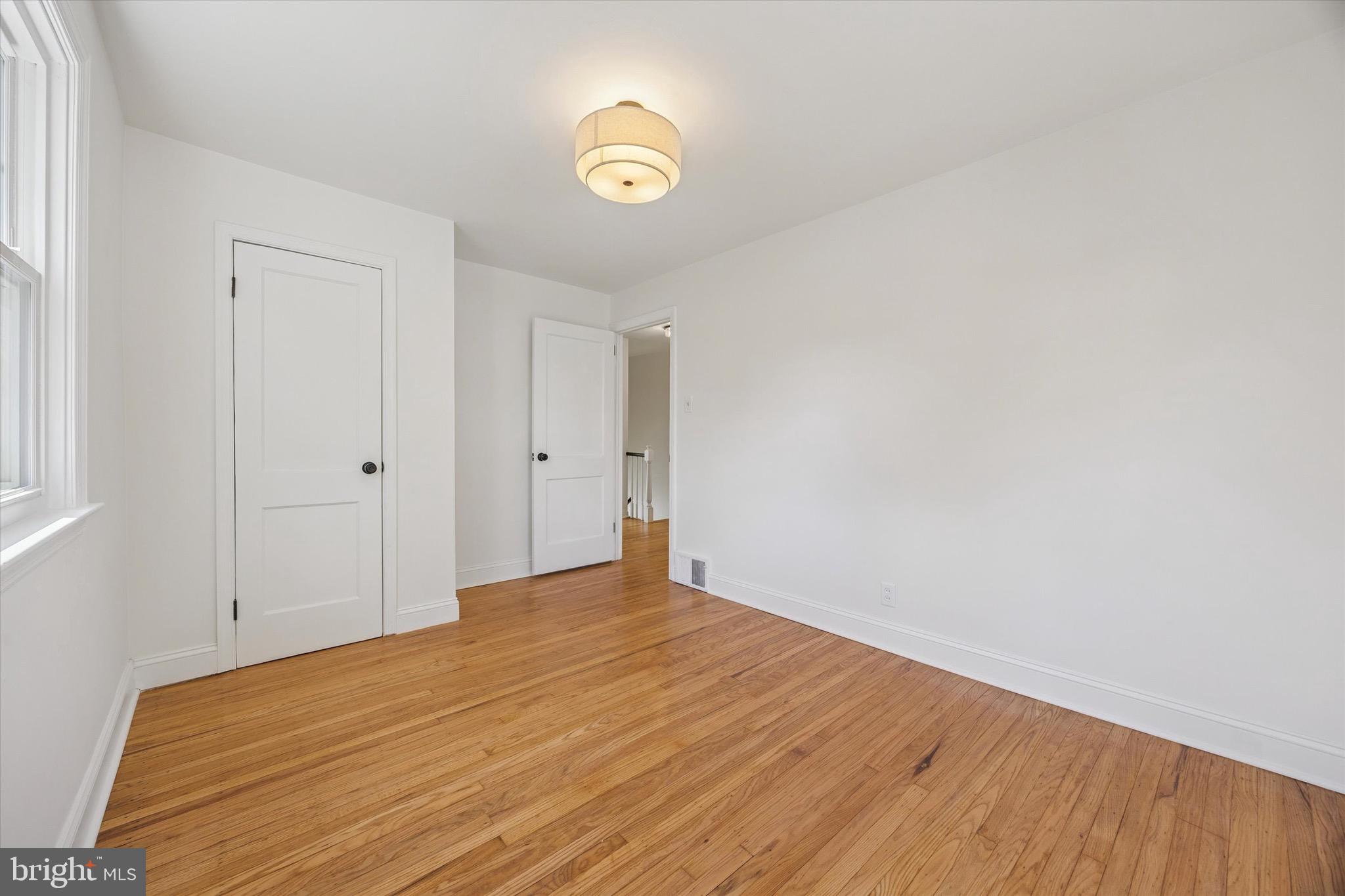 5 Llanfair Road Ardmore, PA 19003 - Photo 21 of 25 a view of empty room with wooden floor