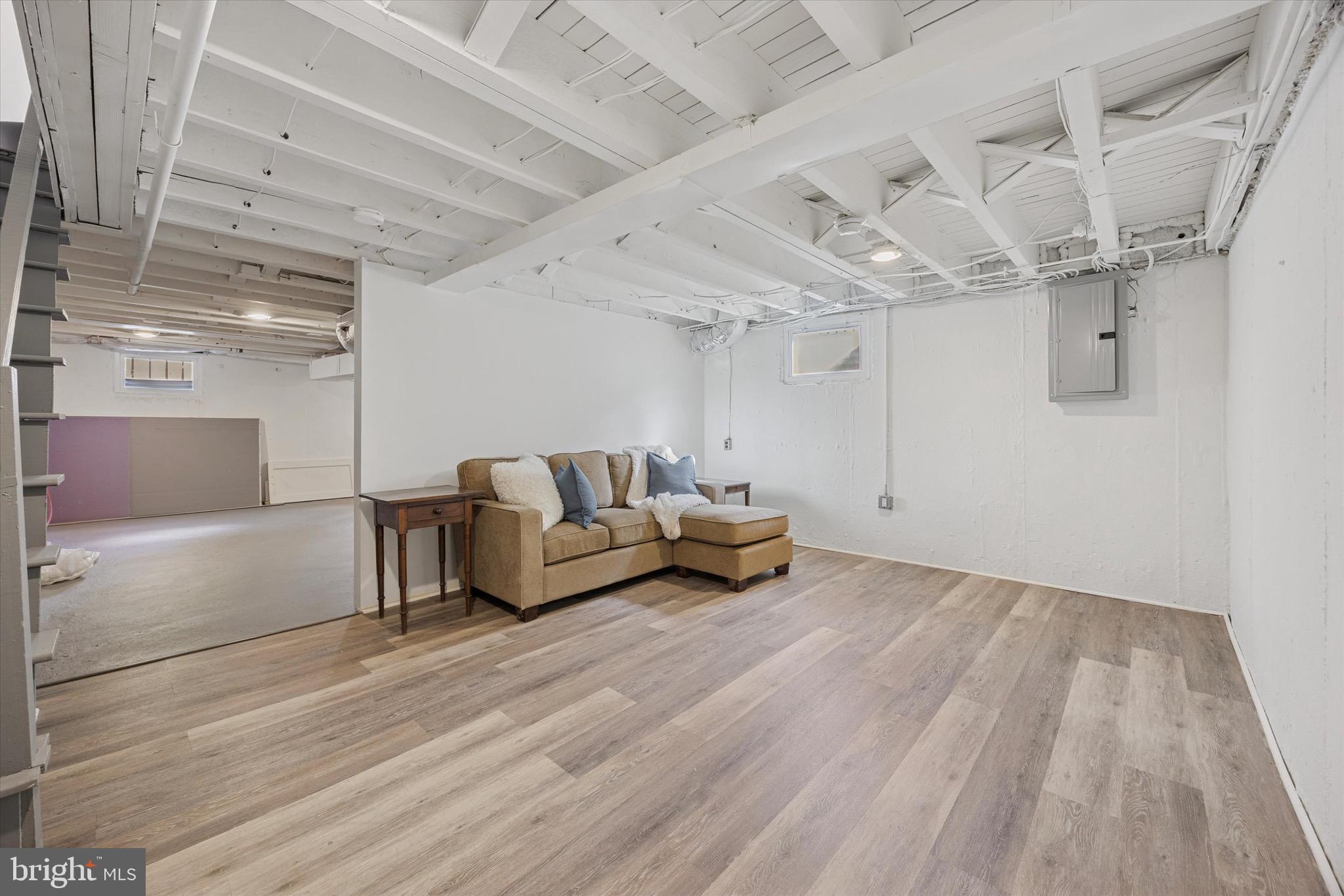 5 Llanfair Road Ardmore, PA 19003 - Photo 24 of 25 a living room with furniture and a wooden floor